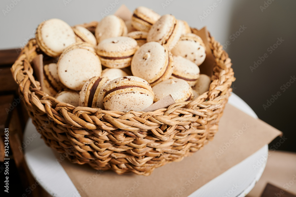 macarons on a plate, cookies on a tray, a cake in a basket, a treat on the festive table of the event