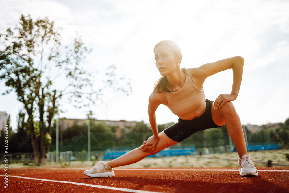 Young woman in sportswear fitness exercise outdoors. Sport, Active life, sports training, healthy lifestyle.