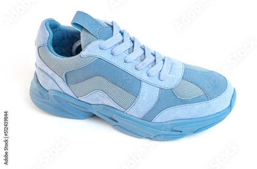 One Light blue sneaker on a white background. Sports shoes