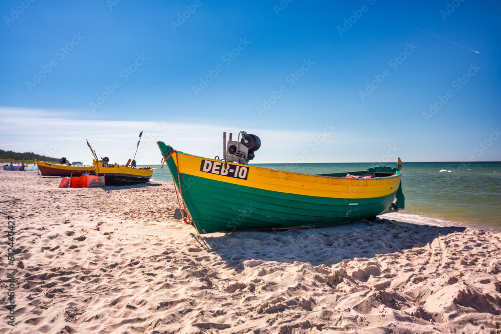 Fototapeta premium Fishing boat on the sunny Baltic Sea beach in Debki. Poland