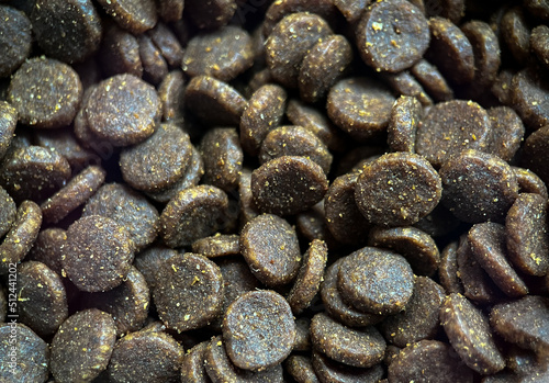 Dry food for cats and dogs close-up. Food for cats and dogs. A bunch of granulated animal feed