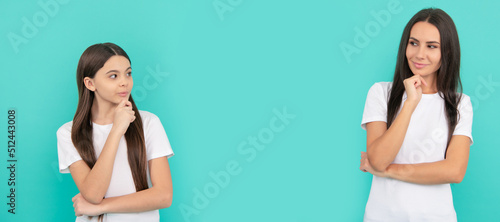 Mother and daughter child banner, copy space, isolated background. Thoughtful mother and daughter with pensive look keep hands on chin blue background, imagination.