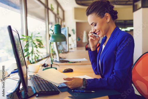 
Beautiful business woman in the interior in the process of work