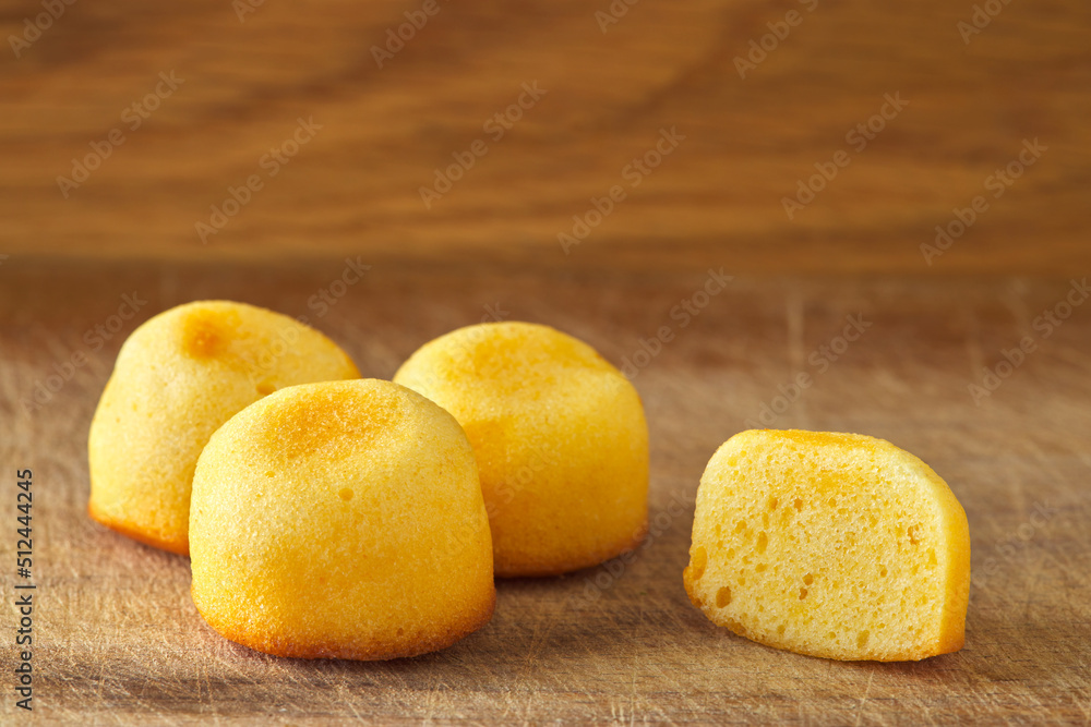 Small cakes on a wooden rustic background Small cakes on a wooden rustic background