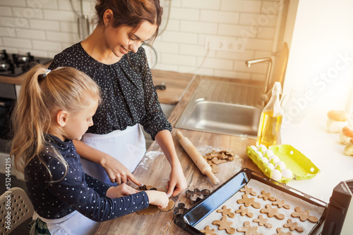 woman cooking with their child