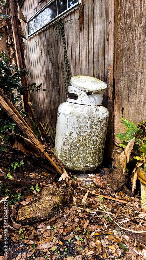Propane Steel Tank Abandonded In a Messy Yard Propane Steel Tank Abandonded In a Messy Yard