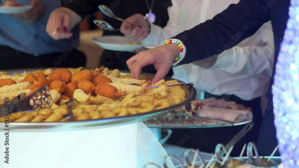 Wedding, buffet, guests take food. Wedding, buffet, guests take food.