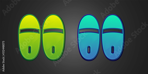 Green and blue Slippers icon isolated on black background. Flip flops sign. Vector