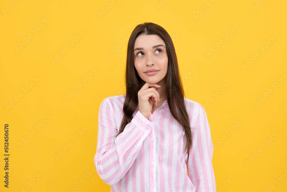 Portrait of young woman thinking, looking up empty space. Thoughtful serious model in studio looking away. Girl thought choose decide solve problems. Portrait of young woman thinking, looking up empty space. Thoughtful serious model in studio looking away. Girl thought choose decide solve problems.