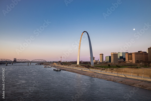 Sunset time with blue and magenta sky at Gateway Arch National Park of St. Louis and Mississippi River 