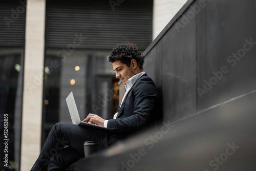 Canvastavla Using a laptop, a financier goes to a new office, a man in a business suit, a ha