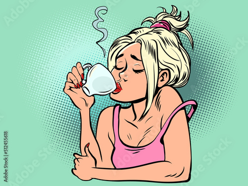 A woman drinks a cup of coffee in the morning. Cafeteria, restaurant hot drink