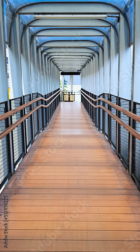 Wooden pedestrian bridge aisle and stairs