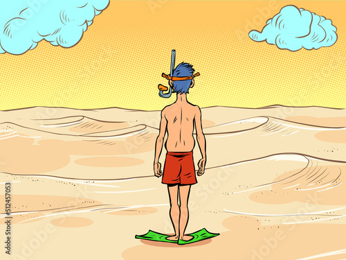 a man in a scuba diving mask stands in front of the desert sands, there is no water. Global warming ecology concept