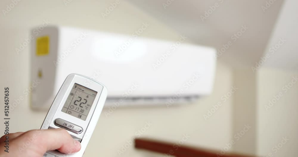 man turning on the air conditioner man turning on the air conditioner