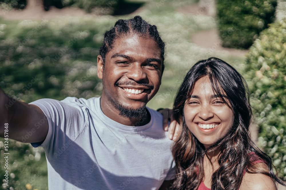 Selfie of multi ethnic athletic couple outdoors Selfie of multi ethnic athletic couple outdoors