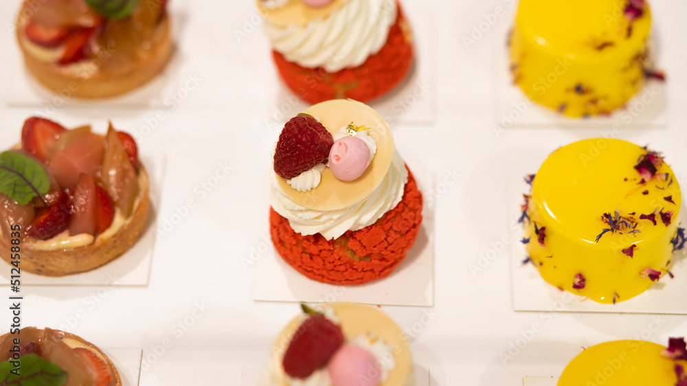 cake with strawberry and raspberry flavor poured over with red velvet and decorated with fruits and chocolate, as well as fruit soufflé. Photography for restaurants and cafes. Advertising cafe with ca cake with strawberry and raspberry flavor poured over with red velvet and decorated with fruits and chocolate, as well as fruit soufflé. Photography for restaurants and cafes. Advertising cafe with ca