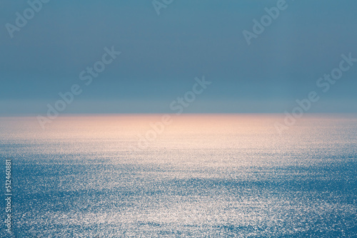 Abstract landscape. Blue background. Serene ocean water and sun light © Inna