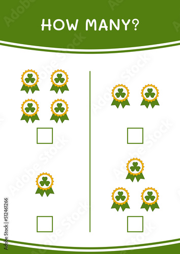 How many of Clover badge, game for children. Vector illustration, printable worksheet © KidsStation
