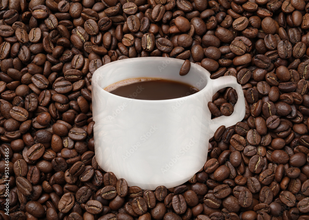 Fototapeta premium Cup of tasty espresso and roasted coffee beans