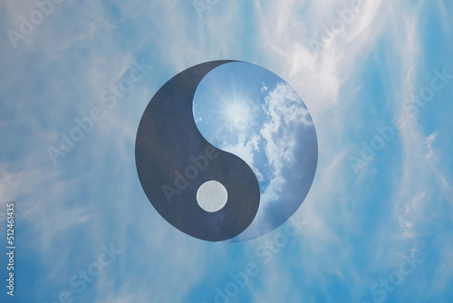 Ying Yang symbol against blue sky. Feng Shui philosophy