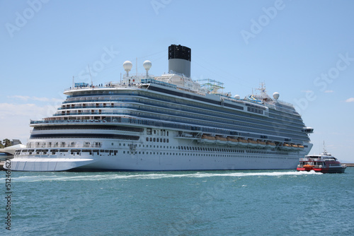 Modern cruise ship and boat in sea on sunny day © New Africa