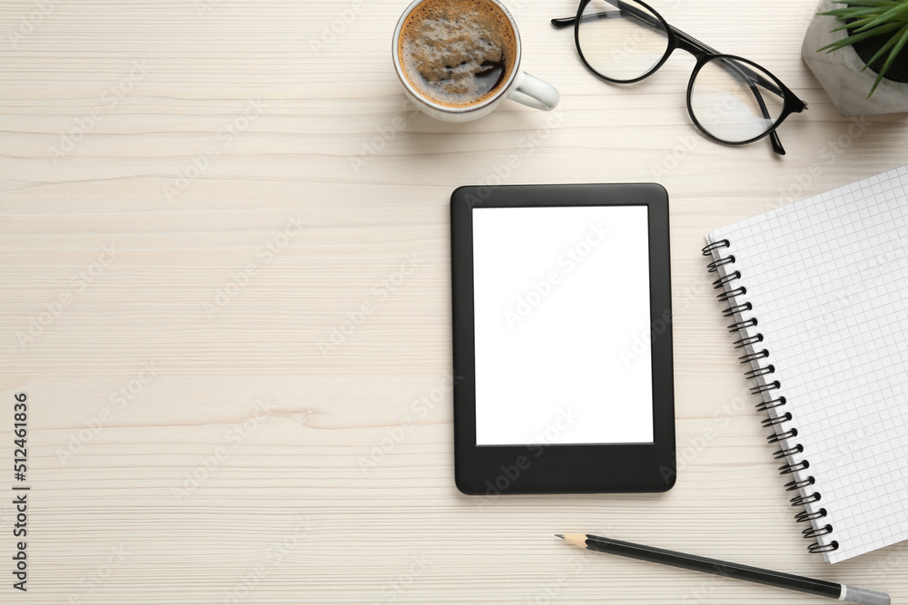 Flat lay composition with modern e-book reader on white wooden table, space for text Flat lay composition with modern e-book reader on white wooden table, space for text