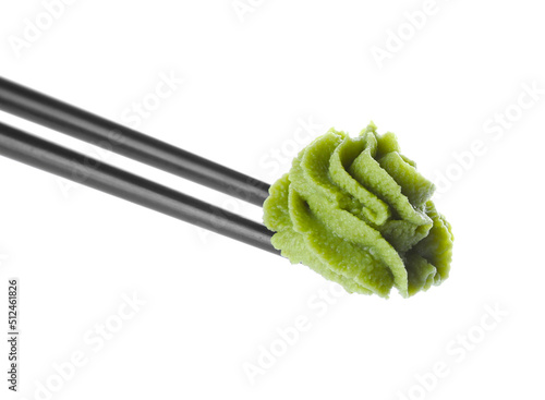 Schilderij op canvas Chopsticks with swirl of wasabi paste isolated on white