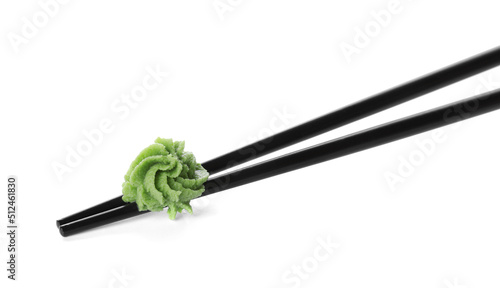 Obraz na płótnie Chopsticks with swirl of wasabi paste isolated on white