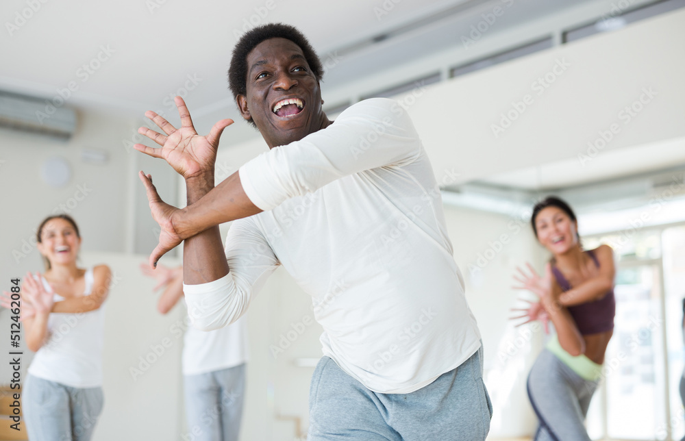 Fototapeta premium Group of multinational activity people practicing dance techniques