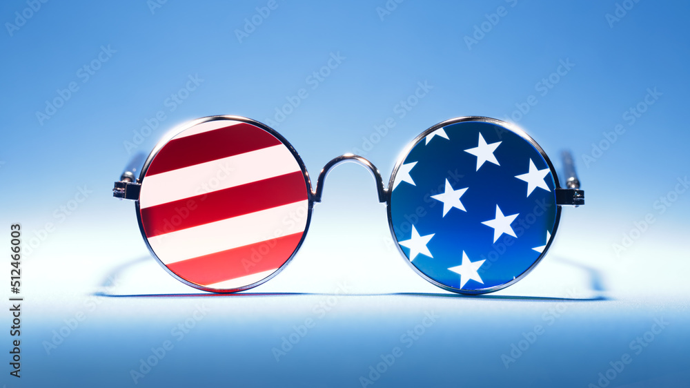 Cool red, white, and blue sunglasses in the pattern of the US American flag. For USA 4th of July or other patriotic celebrations. - obrazy, fototapety, plakaty 