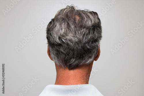 Mature man with salt and pepper hair starting to turn gray