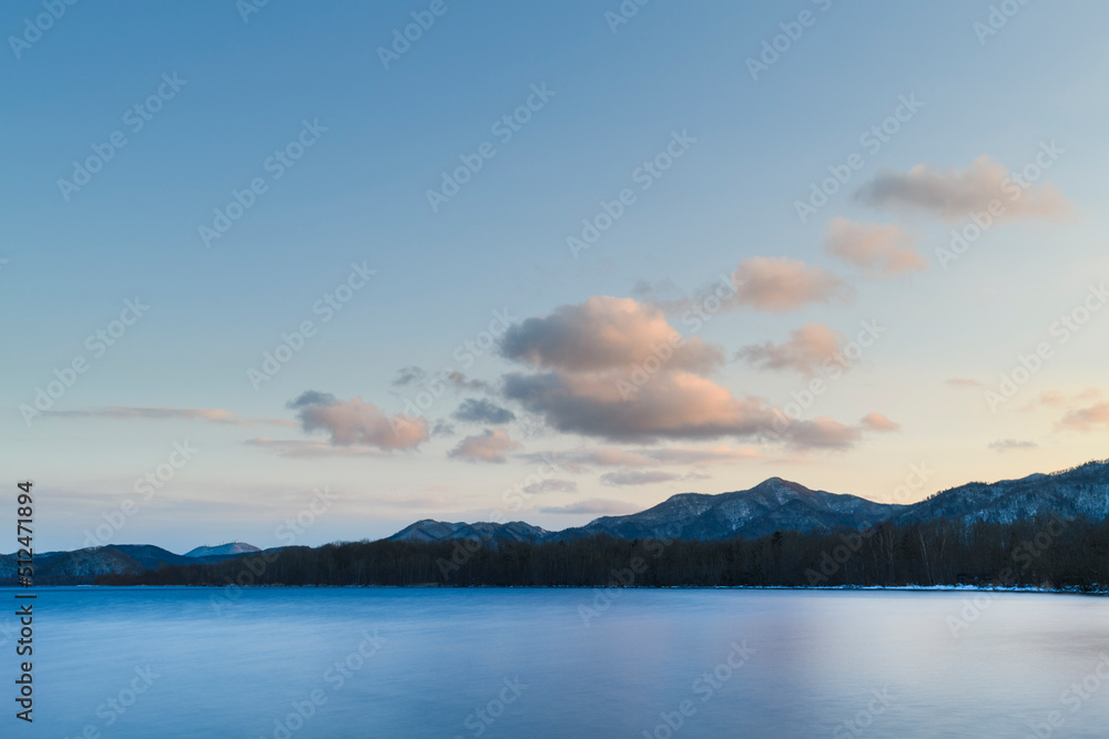 Long exposure sunset view of lake Kussharo from Wakoto Peninsula in winter, Hokkaido, Japan