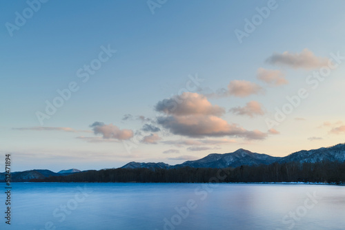 Long exposure sunset view of lake Kussharo from Wakoto Peninsula in winter  Hokkaido  Japan
