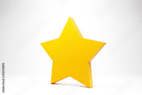 Big yellow shiny star with soft shadow on white background . Realistic design. 3D illustration.