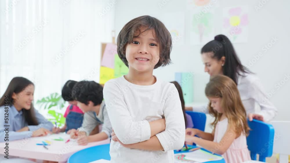 Portrait of Asian kid boy student stand with happiness in class room. Portrait of Asian kid boy student stand with happiness in class room.
