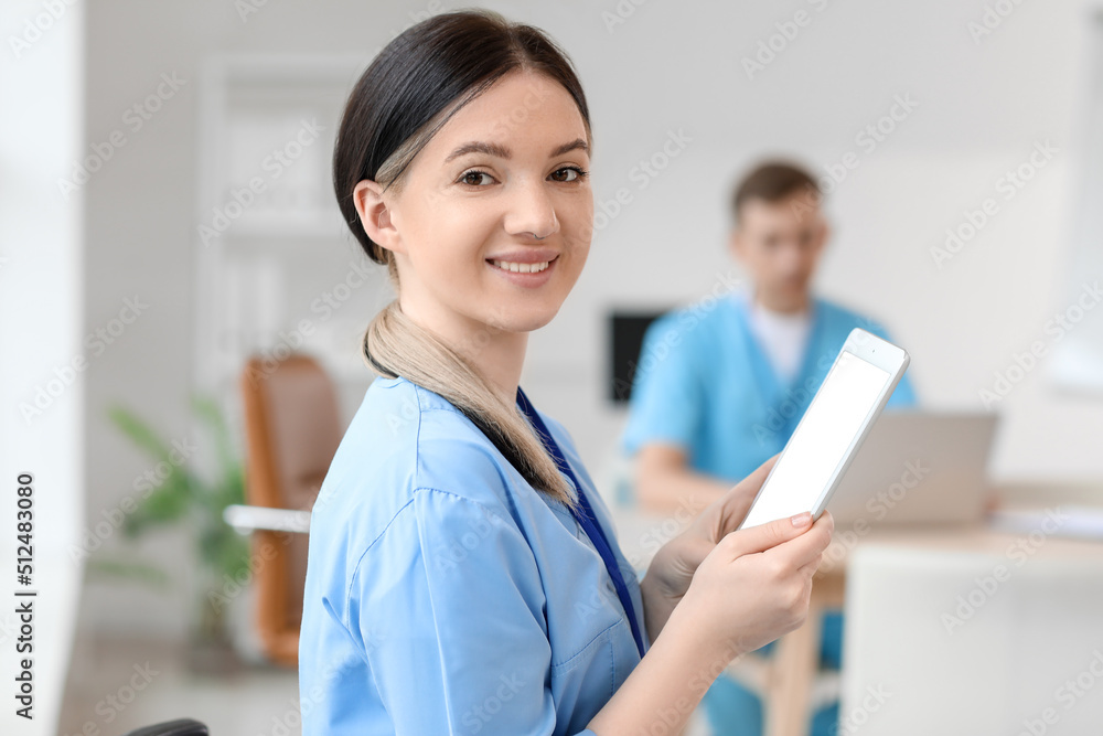 Female medical assistant working with tablet computer at hospital Female medical assistant working with tablet computer at hospital