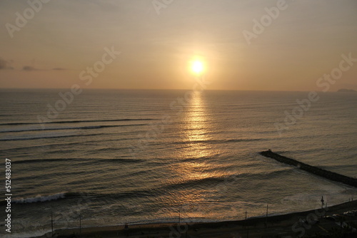 puesta de sol en una playa en miraflores lima peru  photo