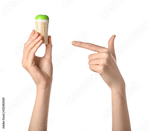Woman pointing at box with bamboo toothpicks on white background