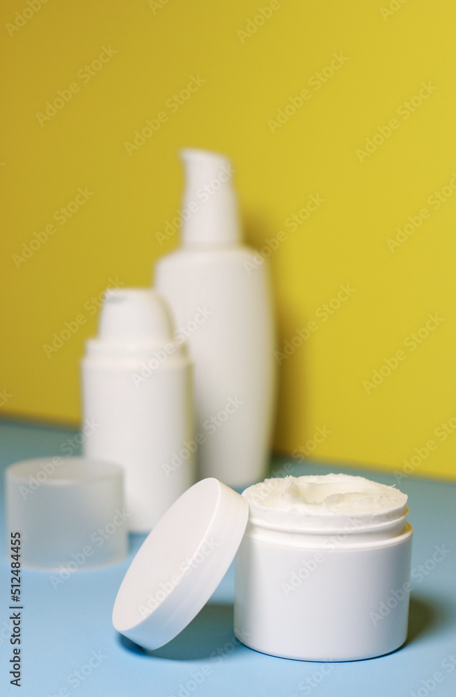 mock up of white jar of cream on a yellow background. Ready place for the label, copy space mock up of white jar of cream on a yellow background. Ready place for the label, copy space