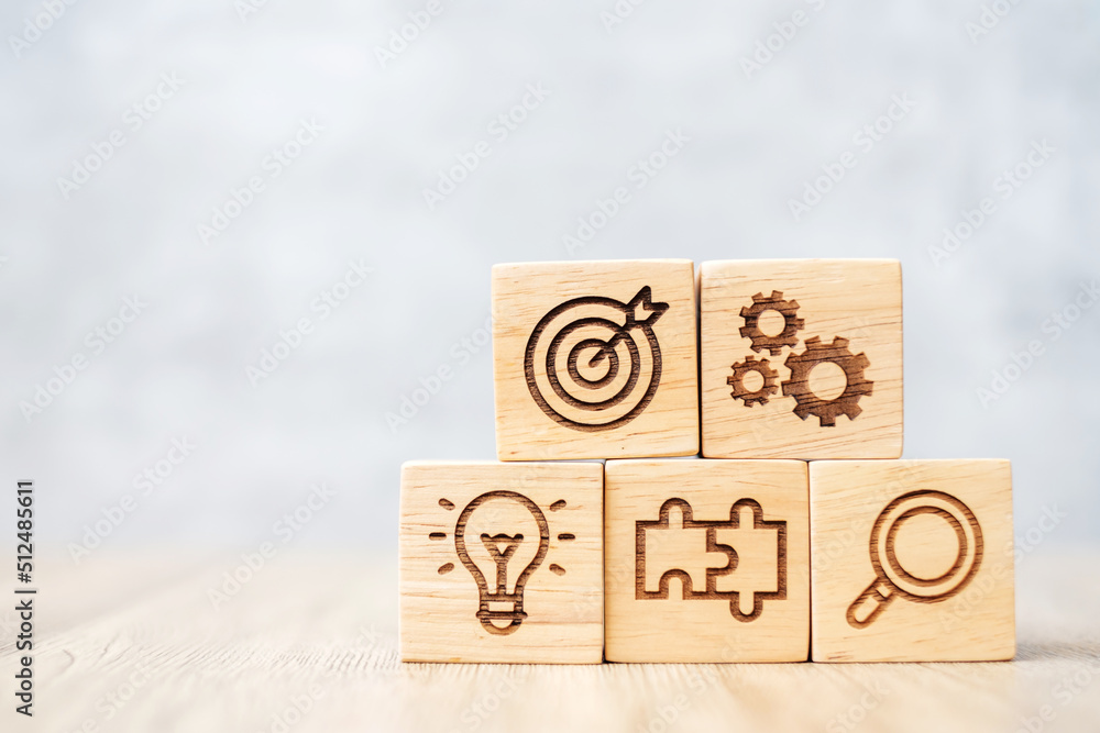 wood block with business goal, strategy, target, mission, action, objective, teamwork, research and idea concept wood block with business goal, strategy, target, mission, action, objective, teamwork, research and idea concept
