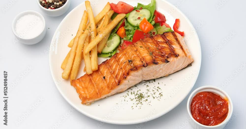 Grilled salmon and vegetables, Top view, rotation Grilled salmon and vegetables, Top view, rotation