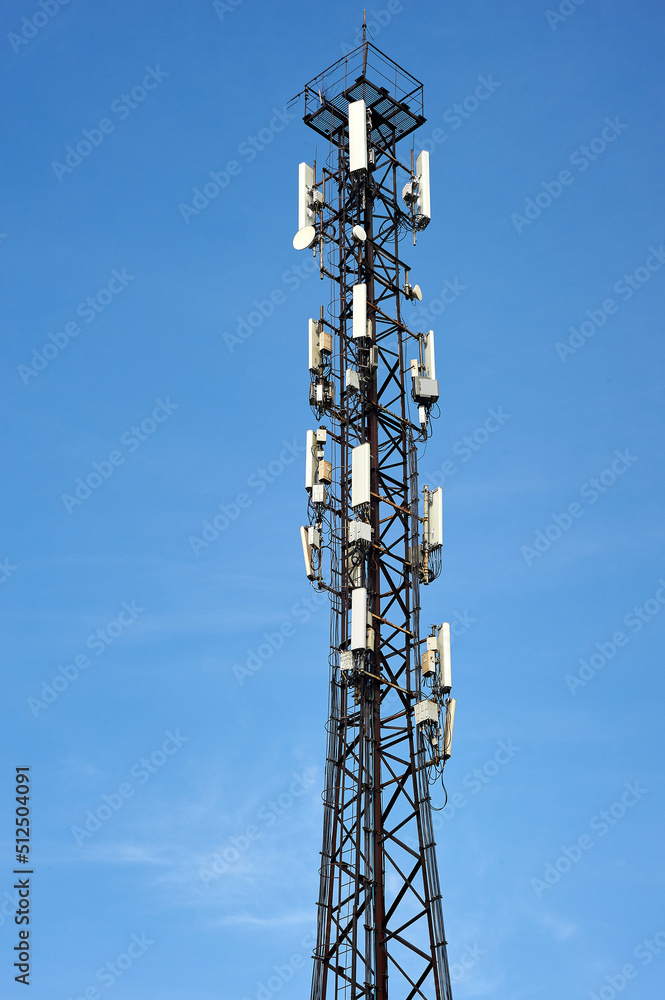 cell phone tower on a blue sky background cell phone tower on a blue sky background