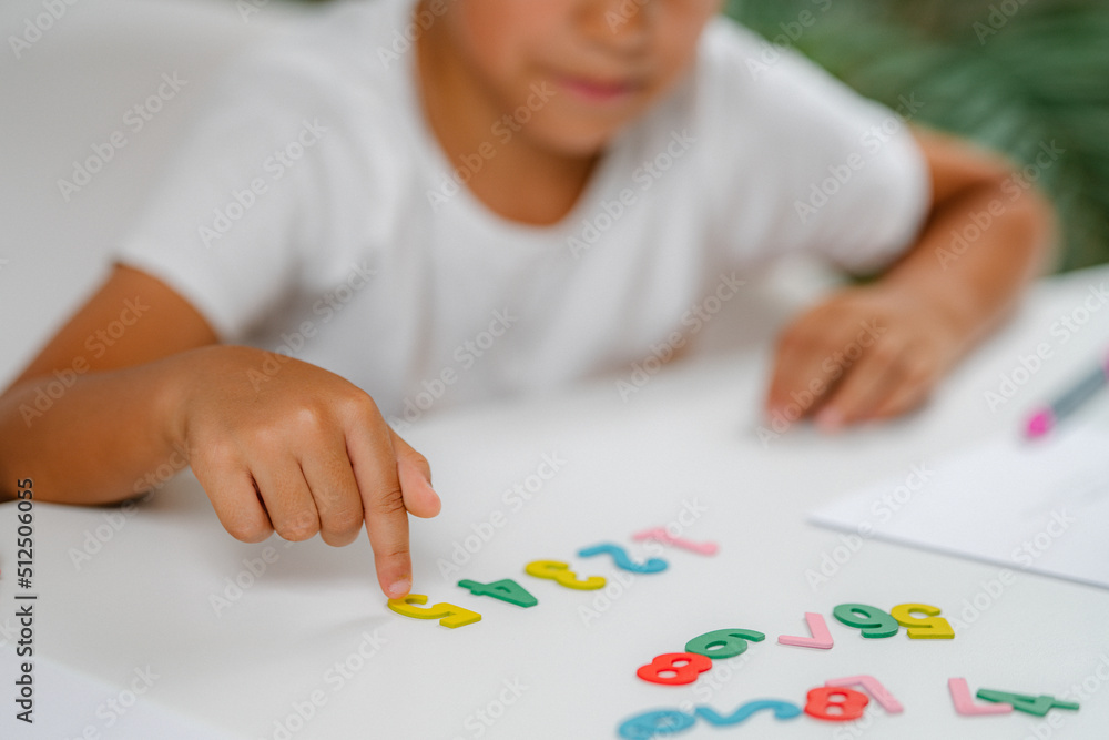 Preschooler Boy playing with numbers Preschooler Boy playing with numbers
