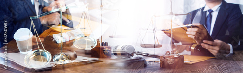 Business and lawyers discussing contract papers with brass scale on desk in office. Law, legal services, advice, justice and law concept picture with film grain effect