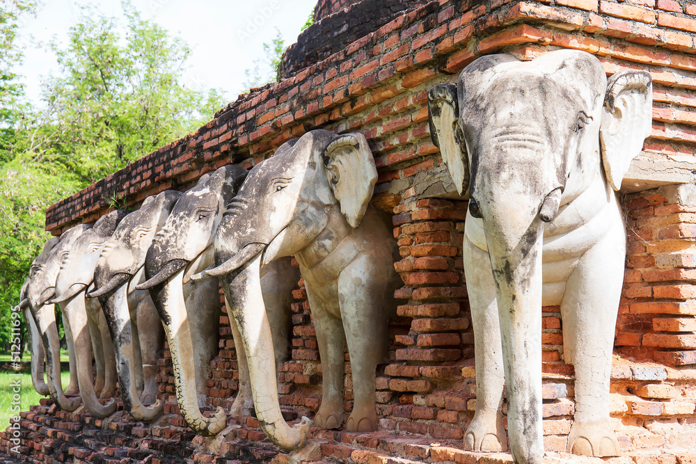 Fototapeta premium June 6, 2022, Sukhothai : Statue of elephants surrounded pagoda at Wat Sorasak,Temple in Sukhothai Historical Park, Sukhothai province,Thailand.