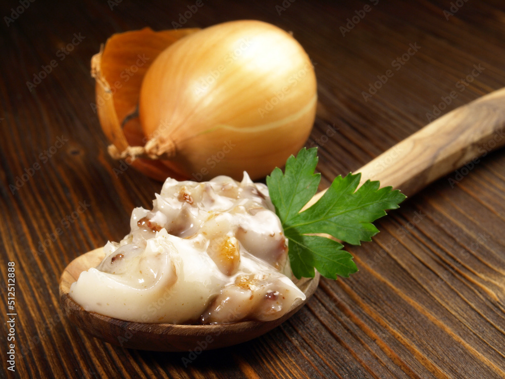 Pork Lard - Rendered Pig Fat on a Spoon on wooden Background Pork Lard - Rendered Pig Fat on a Spoon on wooden Background