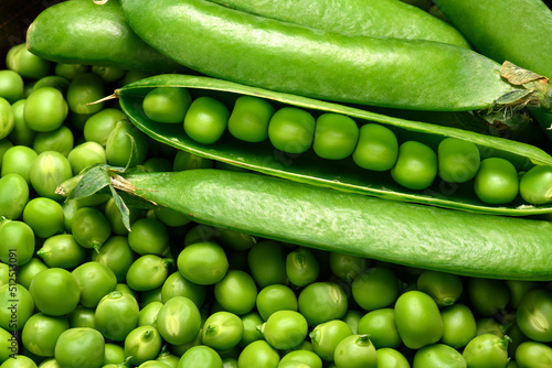 green peas in detail as a background, the concept of fresh vegetables and healthy food photo