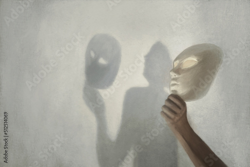 surreal shadow on the wall of a person who takes off the mask from his face, concept of truth and fiction photo