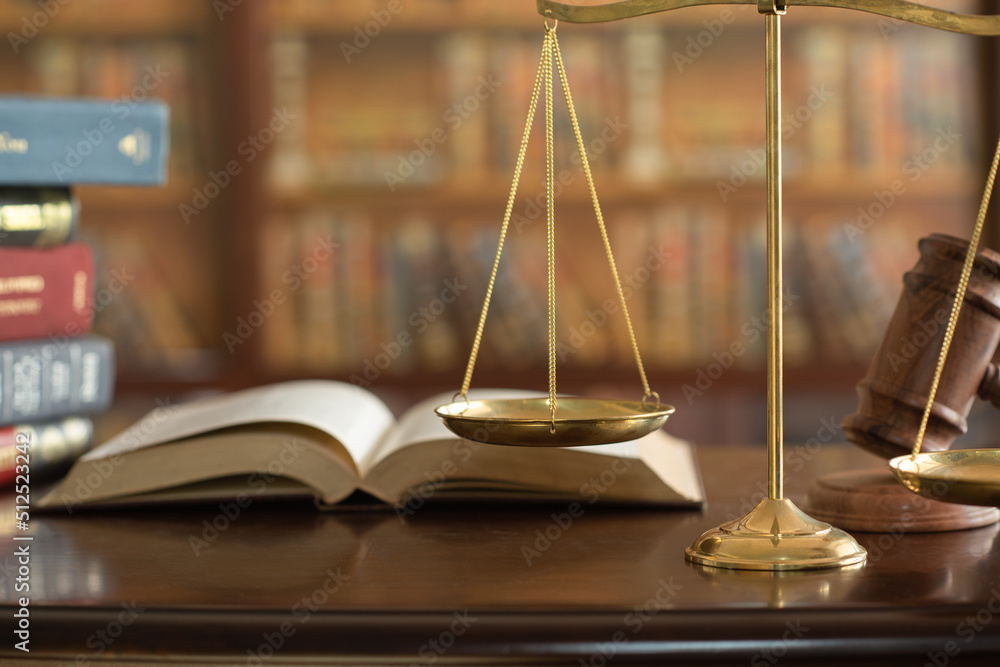 Justice and Law Concept. Scales of justice and legal book in courtroom. Justice and Law Concept. Scales of justice and legal book in courtroom.